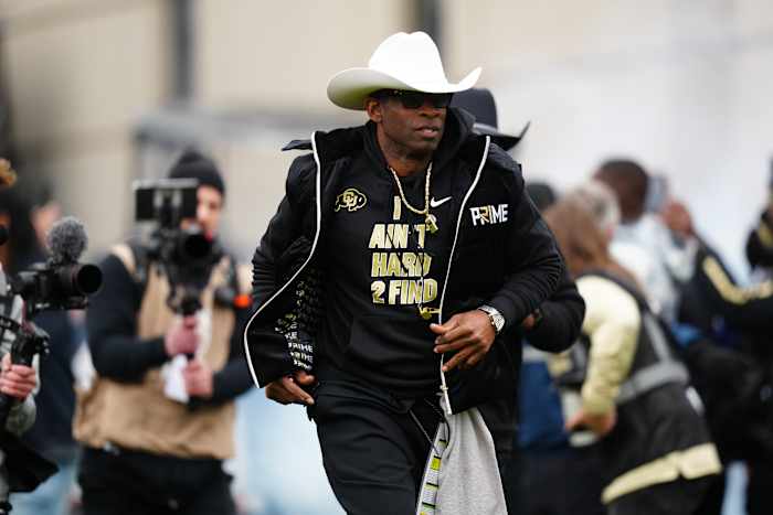 Colorado Buffaloes head coach Deion Sanders hits the field before the start of the spring game at Folsom Field